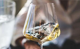 swirling white wine in a glass